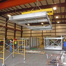 Cyrco roof craned onto fabrication of Stainless XFS Splash Cooling Tower