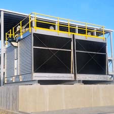 Cyrco custom built metal cooling tower on cement foundation