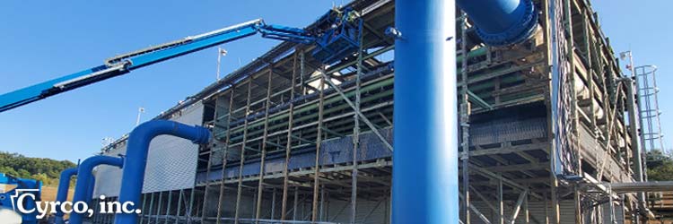 Rebuilt of a field erected cooling tower - new fans, gearboxes, fill media, fiberglass louvers, fiberglass casing, wood framing