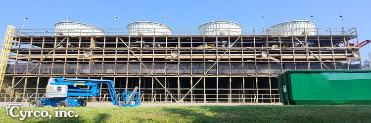 Reconstruction of a field erected fep cooling tower - new frp casing, fill media, fan assemblies, fan stacks