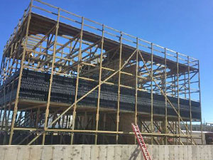 Wooden framed construction of field erected cooling tower with drift eliminator installed